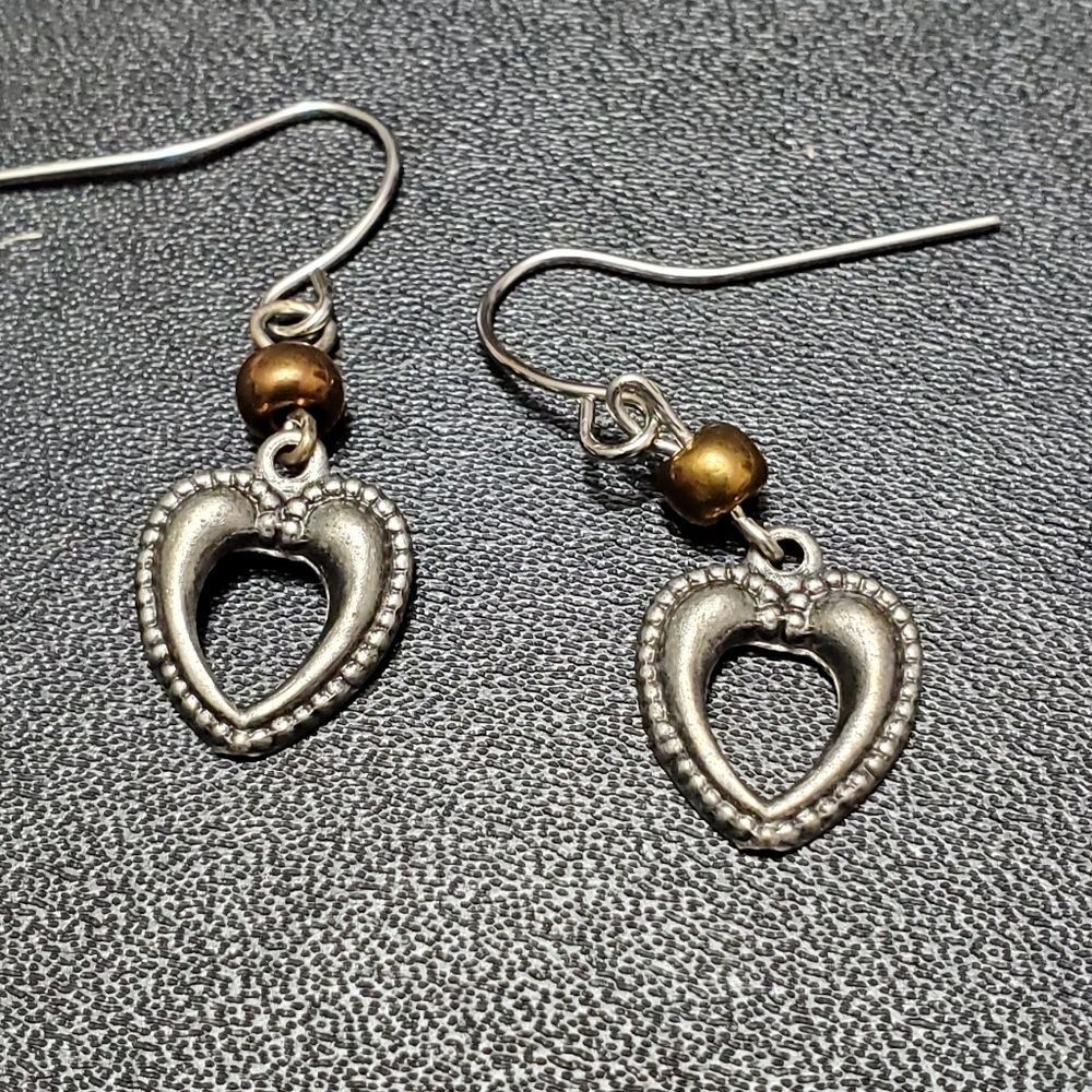 Silver tone dangling heart earrings